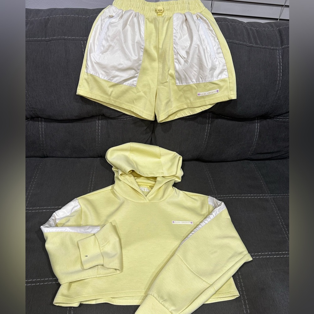 2piece shorts set.see visible marks on sleeves,one of which seems to be ink mark